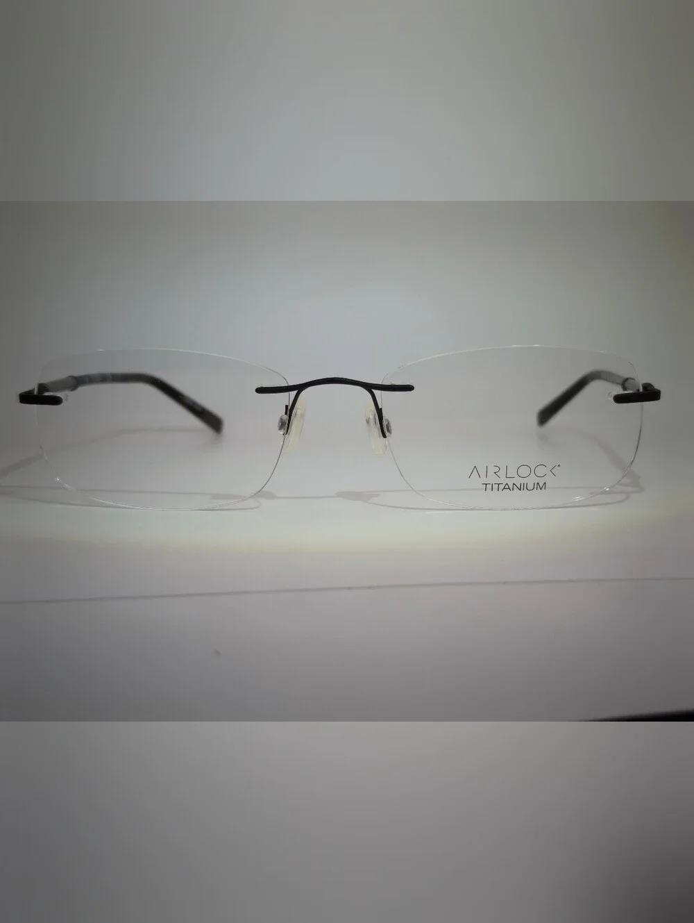 Airlock Titanium. Rimless Compression Mount. Patterns Mounting Bushing Inc.